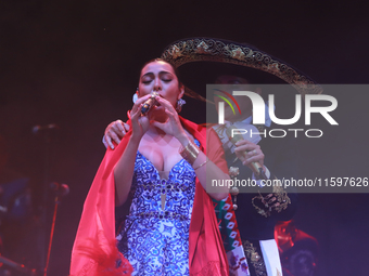 Valeria Cuevas with the Mariachi Real de la Montana performs during the Maraton de Mariachis de la Ciudad de Mexico at Zocalo main square, w...