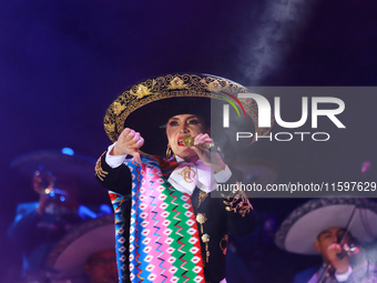 Aida Cuevas with the Mariachi Real de la Montana performs during the Maraton de Mariachis de la Ciudad de Mexico at Zocalo main square, whos...