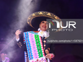 Aida Cuevas with the Mariachi Real de la Montana performs during the Maraton de Mariachis de la Ciudad de Mexico at Zocalo main square, whos...