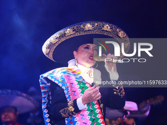 Aida Cuevas with the Mariachi Real de la Montana performs during the Maraton de Mariachis de la Ciudad de Mexico at Zocalo main square, whos...