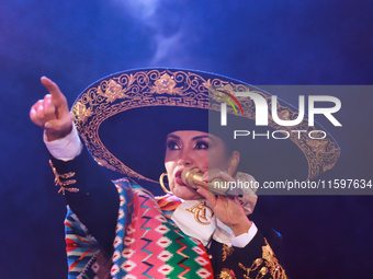 Aida Cuevas with the Mariachi Real de la Montana performs during the Maraton de Mariachis de la Ciudad de Mexico at Zocalo main square, whos...