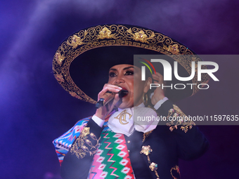 Aida Cuevas with the Mariachi Real de la Montana performs during the Maraton de Mariachis de la Ciudad de Mexico at Zocalo main square, whos...