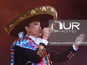 Aida Cuevas with the Mariachi Real de la Montana performs during the Maraton de Mariachis de la Ciudad de Mexico at Zocalo main square, whos...