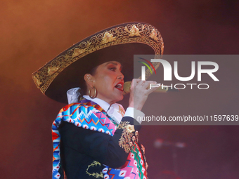 Aida Cuevas with the Mariachi Real de la Montana performs during the Maraton de Mariachis de la Ciudad de Mexico at Zocalo main square, whos...