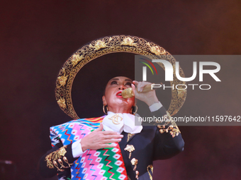 Aida Cuevas with the Mariachi Real de la Montana performs during the Maraton de Mariachis de la Ciudad de Mexico at Zocalo main square, whos...