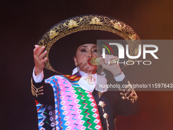 Aida Cuevas with the Mariachi Real de la Montana performs during the Maraton de Mariachis de la Ciudad de Mexico at Zocalo main square, whos...