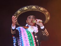 Aida Cuevas with the Mariachi Real de la Montana performs during the Maraton de Mariachis de la Ciudad de Mexico at Zocalo main square, whos...