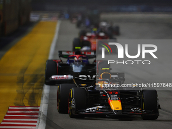 Sergio Perez of Mexico drives the Red Bull Racing-Honda RBPT RB20 during the F1 Grand Prix of Singapore at Marina Bay Street Circuit in Sing...