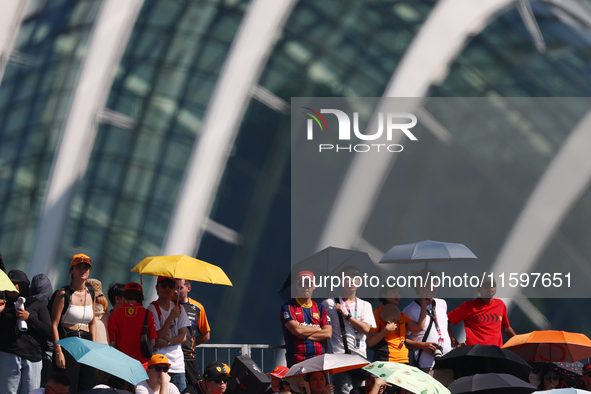 Fans watch ahead of the F1 Grand Prix of Singapore at Marina Bay Street Circuit in Singapore, Singapore, on September 22, 2024. 