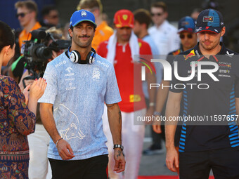 Daniel Ricciardo of Australia and Visa Cash App RB F1 Team and Max Verstappen of the Netherlands and Red Bull Racing-Honda RBPT appear durin...