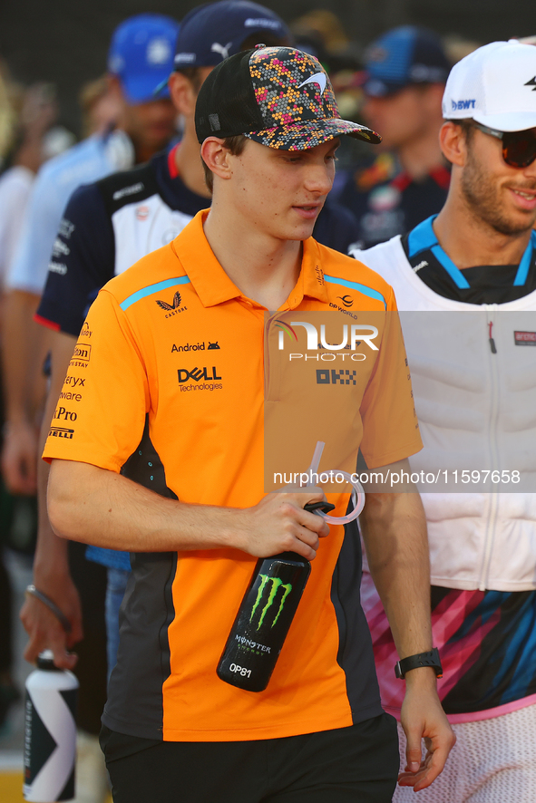 Oscar Piastri of Australia and the McLaren Formula 1 Team participate in the drivers' parade before the F1 Grand Prix of Singapore at Marina...