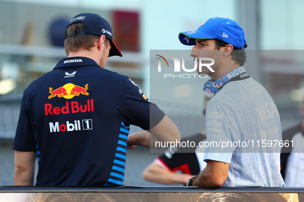 Max Verstappen of the Netherlands and Red Bull Racing-Honda RBPT and Daniel Ricciardo of Australia and Visa Cash App RB F1 Team appear durin...