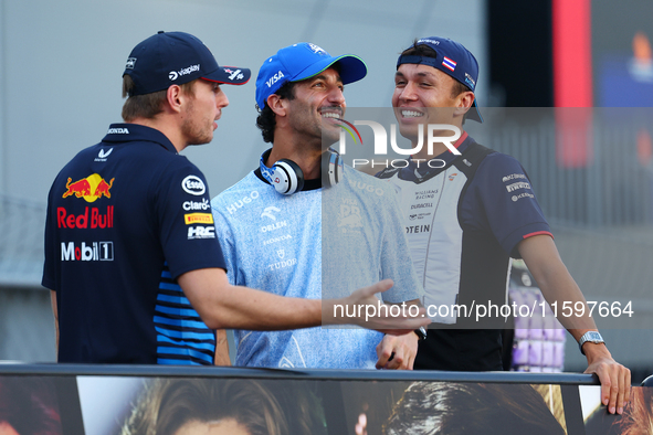 Daniel Ricciardo of Australia and Visa Cash App RB F1 Team reacts during the drivers' parade ahead of the F1 Grand Prix of Singapore at Mari...