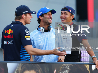 Daniel Ricciardo of Australia and Visa Cash App RB F1 Team reacts during the drivers' parade ahead of the F1 Grand Prix of Singapore at Mari...