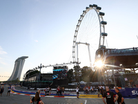 A general view of the sunset behind the Singapore Flyer during the drivers' parade ahead of the F1 Grand Prix of Singapore at Marina Bay Str...