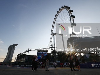 A general view of the sunset behind the Singapore Flyer during the drivers' parade ahead of the F1 Grand Prix of Singapore at Marina Bay Str...