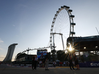 A general view of the sunset behind the Singapore Flyer during the drivers' parade ahead of the F1 Grand Prix of Singapore at Marina Bay Str...