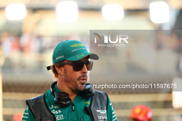 Fernando Alonso of Spain and the Aston Martin Aramco F1 Team participates in the drivers' parade ahead of the F1 Grand Prix of Singapore at...