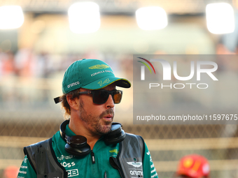 Fernando Alonso of Spain and the Aston Martin Aramco F1 Team participates in the drivers' parade ahead of the F1 Grand Prix of Singapore at...