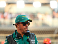 Fernando Alonso of Spain and the Aston Martin Aramco F1 Team participates in the drivers' parade ahead of the F1 Grand Prix of Singapore at...