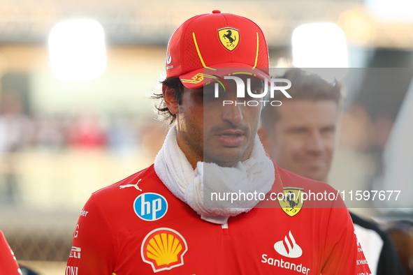 Carlos Sainz of Spain and Scuderia Ferrari participates in the drivers' parade ahead of the F1 Grand Prix of Singapore at Marina Bay Street...