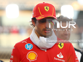 Carlos Sainz of Spain and Scuderia Ferrari participates in the drivers' parade ahead of the F1 Grand Prix of Singapore at Marina Bay Street...