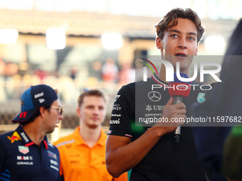 George Russell of the United Kingdom and Mercedes-AMG Petronas F1 Team participates in the drivers' parade ahead of the F1 Grand Prix of Sin...