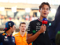 George Russell of the United Kingdom and Mercedes-AMG Petronas F1 Team participates in the drivers' parade ahead of the F1 Grand Prix of Sin...