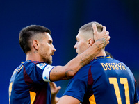 Artem Dovbyk of AS Roma celebrates after scoring first goal during the Serie A Enilive match between AS Roma and Udinese Calcio at Stadio Ol...