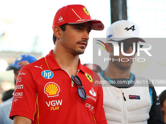 Charles Leclerc of Monaco and Scuderia Ferrari participates in the drivers' parade before the F1 Grand Prix of Singapore at Marina Bay Stree...