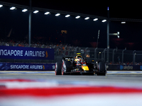 Sergio Perez of Mexico and Red Bull Racing-Honda RBPT drives to the grid ahead of the F1 Grand Prix of Singapore at Marina Bay Street Circui...