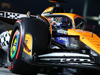 Oscar Piastri of Australia and the McLaren Formula 1 Team drives to the grid ahead of the F1 Grand Prix of Singapore at Marina Bay Street Ci...