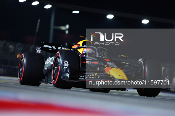 Max Verstappen of the Netherlands and Red Bull Racing-Honda RBPT drives to the grid ahead of the F1 Grand Prix of Singapore at Marina Bay St...