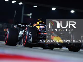 Max Verstappen of the Netherlands and Red Bull Racing-Honda RBPT drives to the grid ahead of the F1 Grand Prix of Singapore at Marina Bay St...