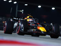 Max Verstappen of the Netherlands and Red Bull Racing-Honda RBPT drives to the grid ahead of the F1 Grand Prix of Singapore at Marina Bay St...