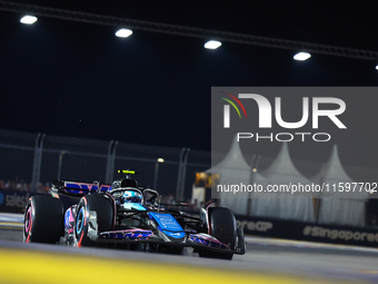 Pierre Gasly of France and BWT Alpine F1 Team drives to the grid ahead of the F1 Grand Prix of Singapore at Marina Bay Street Circuit in Sin...