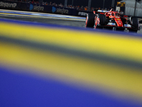 Charles Leclerc of Monaco and Scuderia Ferrari drives to the grid ahead of the F1 Grand Prix of Singapore at Marina Bay Street Circuit in Si...