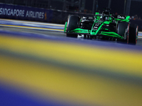 Valtteri Bottas of Finland and Stake F1 Team Kick Sauber drives to the grid ahead of the F1 Grand Prix of Singapore at Marina Bay Street Cir...