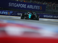 George Russell of the United Kingdom and Mercedes-AMG Petronas F1 Team drives to the grid ahead of the F1 Grand Prix of Singapore at Marina...