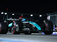 George Russell of the United Kingdom and Mercedes-AMG Petronas F1 Team drives to the grid ahead of the F1 Grand Prix of Singapore at Marina...