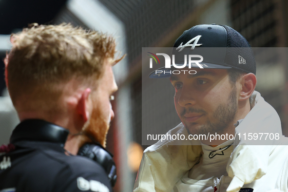 Esteban Ocon of France and BWT Alpine F1 Team stands on the grid ahead of the F1 Grand Prix of Singapore at Marina Bay Street Circuit in Sin...