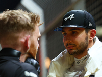 Esteban Ocon of France and BWT Alpine F1 Team stands on the grid ahead of the F1 Grand Prix of Singapore at Marina Bay Street Circuit in Sin...