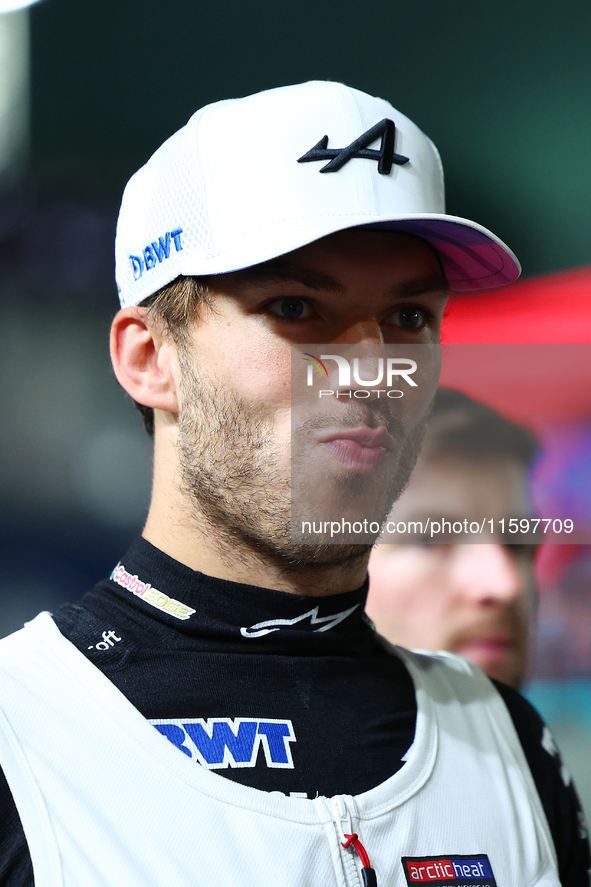 Pierre Gasly of France and BWT Alpine F1 Team stands on the grid ahead of the F1 Grand Prix of Singapore at Marina Bay Street Circuit in Sin...