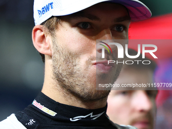 Pierre Gasly of France and BWT Alpine F1 Team stands on the grid ahead of the F1 Grand Prix of Singapore at Marina Bay Street Circuit in Sin...