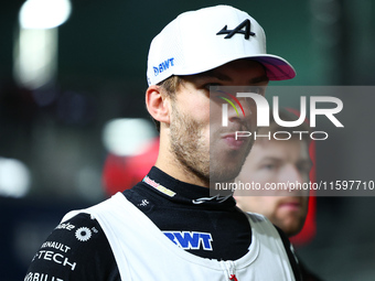 Pierre Gasly of France and BWT Alpine F1 Team stands on the grid ahead of the F1 Grand Prix of Singapore at Marina Bay Street Circuit in Sin...