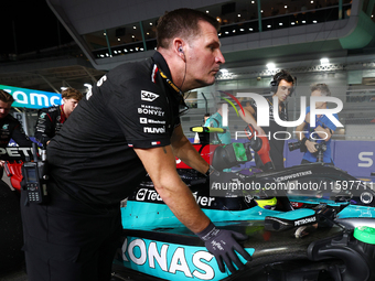 Lewis Hamilton of the United Kingdom drives the Mercedes-AMG Petronas F1 Team F1 W15 on the grid ahead of the F1 Grand Prix of Singapore at...