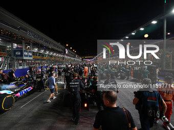 Lewis Hamilton of the United Kingdom drives the Mercedes-AMG Petronas F1 Team F1 W15 on the grid ahead of the F1 Grand Prix of Singapore at...