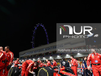 The car of Carlos Sainz of Spain and Scuderia Ferrari is on the grid ahead of the F1 Grand Prix of Singapore at Marina Bay Street Circuit in...