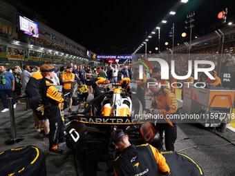 The car of Oscar Piastri of Australia and the McLaren Formula 1 Team is on the grid ahead of the F1 Grand Prix of Singapore at Marina Bay St...