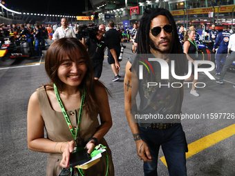 Lenny Kravitz walks on the grid ahead of the F1 Grand Prix of Singapore at Marina Bay Street Circuit in Singapore, Singapore, on September 2...